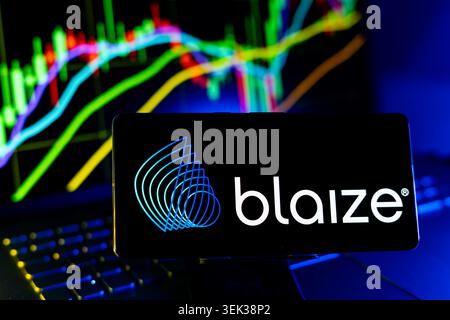 Blaize Logo Displayed On Mobile Phone With Stock Market Performance Chart Background And Trading Graph Interface Stock Photo