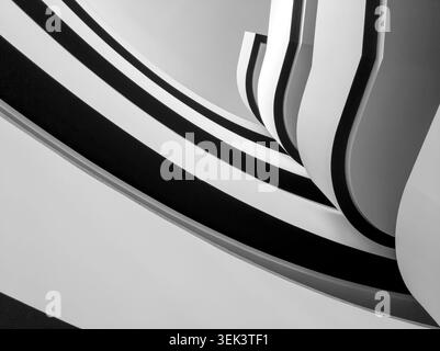 Abstract black and white architecture with curved balconies and geometric lines Stock Photo