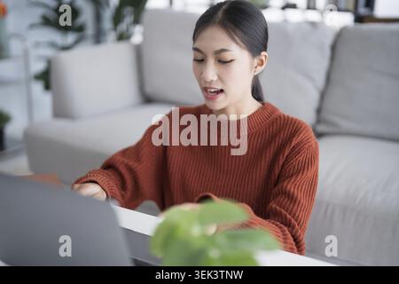 Asian Businesswoman, VDO Conference Call, Work Talk, Chat, Online Video Call on Laptop, Webcam Conference, Work with Laptop, Online Briefing, eLearnin Stock Photo