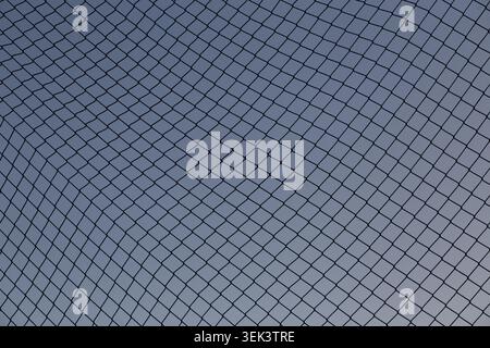 Abstract safety net pattern against blue sky background Stock Photo