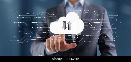A business professional interacts with cloud computing icons on a digital interface representing data exchange and technology integration in modern bu Stock Photo