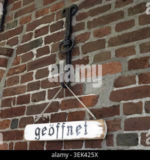 Opened, saw a sign on a house wall on the island of Sylt Stock Photo