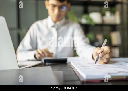 Close-up of businessman hands signing or writing documents, paperwork and report, auditor analysis, male professional hand notes with business documen Stock Photo