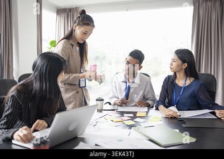 Business people, Asian, multicultural business people working on a project, in office, conference ideas, in founding, diversity, leadership and busine Stock Photo