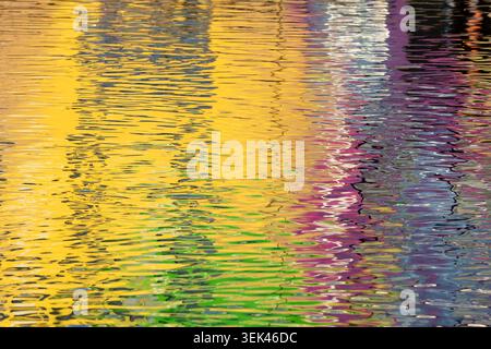 Abstract colorful reflections on the water in the port of Vannes, Brittany, France. Stock Photo