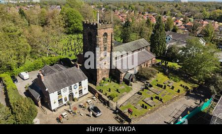 Aerial, Grappenhall village in the Borough of Warrington in Cheshire. Pictured St Wilfrid's Church and the Rams Head Inn Stock Photo