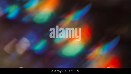 Bokeh spark light. Blur soft crystal. Defocused fluorescent blue red color lens flare flicker beam on abstract art dark black background. Stock Photo
