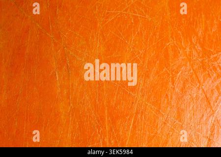 Vibrant orange texture background showing abstract surface distressed pattern bright rough grunge detail evoking an energetic warm feeling for creativ Stock Photo