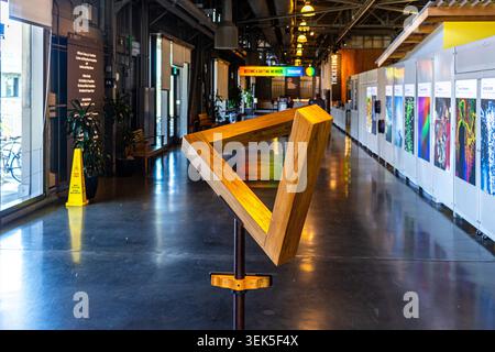 Penrose triangle or impossible triangle model displayed at the Exploratorium in San Francisco, California, demonstrating an optical illusion Stock Photo