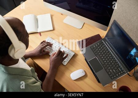 Black Senior Man Learning Online at Home Using Computer Stock Photo