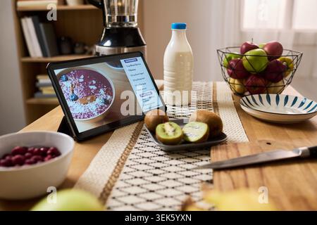 Tablet Displaying Online Smoothie Recipe for Healthy Home Cooking Stock Photo