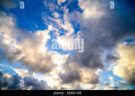 Dramatic Storm Clouds Against Vibrant Blue Sky Stock Photo