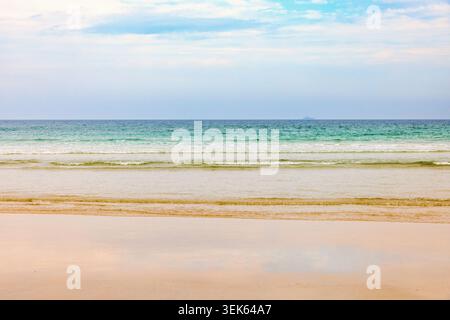 Breaking waves at a sand beach a summer day Stock Photo