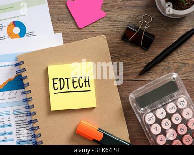 EdTech educational technology investment, funding, budget planning and market analysis concept with handwritten text on sticky note over office desk Stock Photo