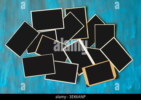 old empty photo frames, vintage blank photographic prints on wood with free space for pictures Stock Photo