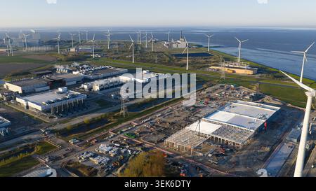 Aerial drone view of the expansion construction of a massive hyperscale data center in Eemshaven, The Netherlands, showing AI infrastructure, cloud co Stock Photo