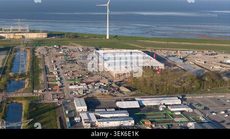 Aerial drone view of the expansion construction of a massive hyperscale data center in Eemshaven, The Netherlands, showing AI infrastructure, cloud co Stock Photo