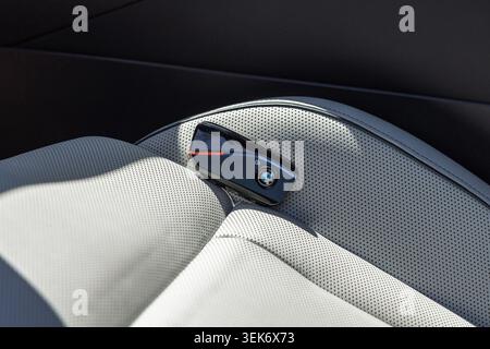 Slovenia, Ljubljana - 8 April 2026: BMW car key sits on the seat of a luxury vehicle with a modern design Stock Photo
