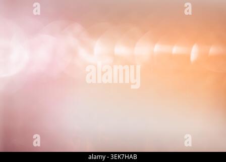 Soft Pastel Bokeh Background with Pink and Orange Hues and Dreamy Light Effect Stock Photo