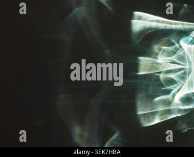 Abstract Light Prism Reflection with Dark Background and Geometric Patterns Stock Photo