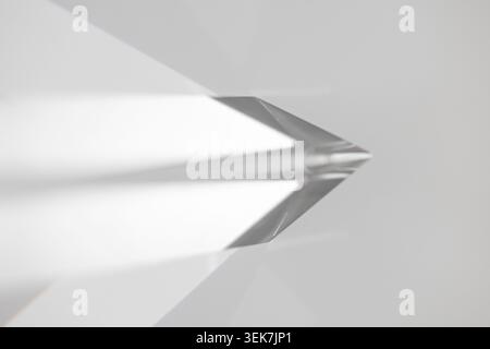 Minimal abstract glass prism background with soft gray tones, sharp geometric reflections, diffused light, and clean modern shadows. Suitable for tech Stock Photo