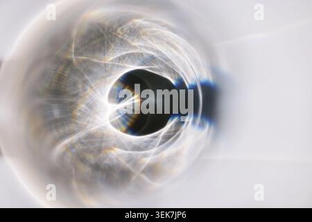 Abstract Light Reflection in Circular Pattern: A Study in Refraction and Color Stock Photo