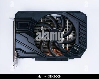 Modern graphics card with fan cooler top view on white background. Computer hardware, gaming GPU rendering unit, electronic component. Stock Photo