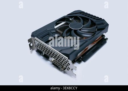 Modern graphics card with fan cooler on white background. Computer hardware, gaming GPU rendering unit, electronic component. Stock Photo