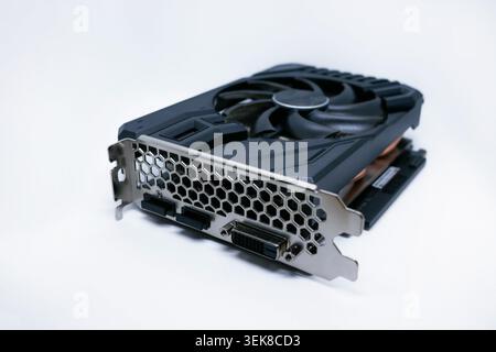 Modern graphics card with fan cooler on white background. Computer hardware, gaming GPU rendering unit, electronic component. Stock Photo
