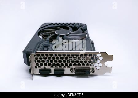 Modern graphics card with fan cooler on white background. Computer hardware, gaming GPU rendering unit, electronic component. Stock Photo