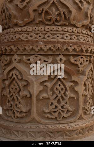 Carved terracotta ganch - ornament detail on the Kalyan Minaret in Bukhara showing intricate floral and geometric patterns. Ideal for use in heritage, Stock Photo