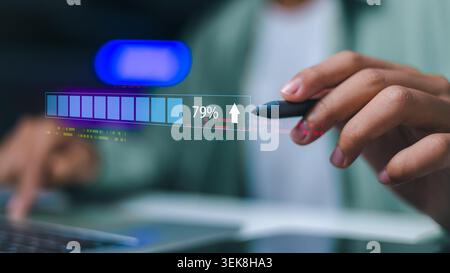 Close up of hand using stylus with digital loading progress bar and 79 percent. Concept of business growth, system upgrade, data processing, and movin Stock Photo