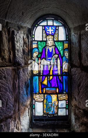 Stained glass window of St Margaret in St Margaret's Chapel in Edinburgh Castle, Scotland, UK Stock Photo