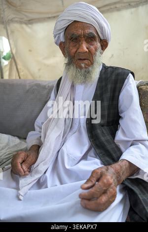 Senior man with a white beard and turban looking into the camera. Stock Photo