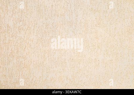 Beige textured plaster wall with vertical stucco pattern for background and interior design Stock Photo