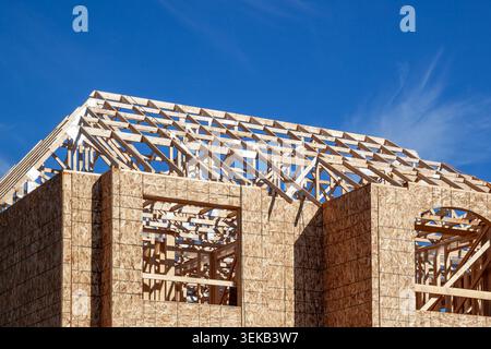 The new house wood framing under construction against the blue sky. Toronto, Ontario, Canada. Stock Photo