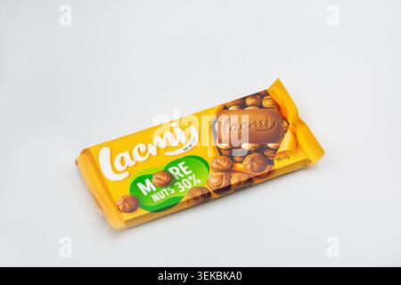 Kyiv, Ukraine - May 17, 2024: Packages of Roshen milk chocolate bar with whole hazelnuts Lacmi, product shot closeup on white background. Stock Photo