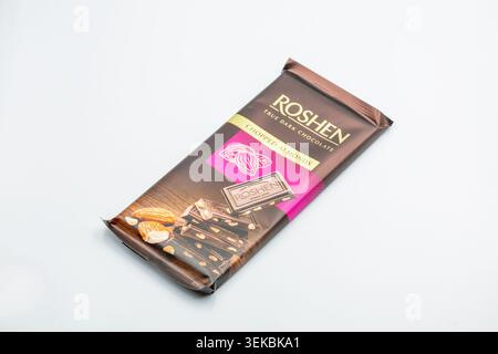 Kyiv, Ukraine - May 17, 2024: Package of Roshen True Dark Chocolate with chopped almonds, product shot closeup on white background. Stock Photo
