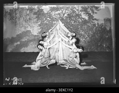 A press photograph records participants rehearsing for the Mlle Jolly gala of the Andrée Joly school on the stage of the Théâtre de Paris in Paris on 25 March 1933. Young women practise coordinated dance and rhythmic gymnastics sequences for the forthcoming performance. Stock Photo