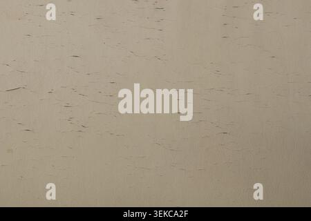 Old white faux leather with scuffs, cracks, and signs of wear as a texture for furniture, upholstery, backdrops, aged leather, upholstery Stock Photo