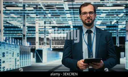 Monitoring system, AR simulation and engineer portrait in data center, identifying performance bottlenecks. Implementing optimizations, VFX compositing and worker in server farm using device, camera A Stock Photo