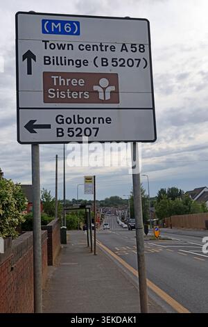 Bolton Road direction sign in Ashton-in-Makerfield for A58 town centre, Billinge, Three Sisters and Golborne Stock Photo