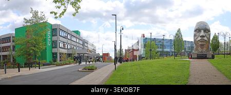 Wigan Civic Centre and Face of Wigan sculpture panorama in Wigan, Greater Manchester, England, UK. Stock Photo