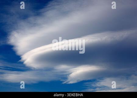 Lenticular cloud formation in blue sky over Calgary, Alberta, Canada Stock Photo