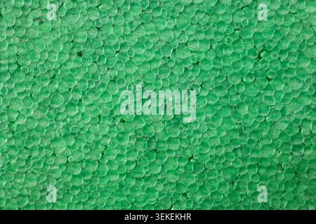Green Polystyrene Foam Texture Background, Close Up Macro Pattern of Expanded Styrofoam Surface for Packaging and Construction Stock Photo