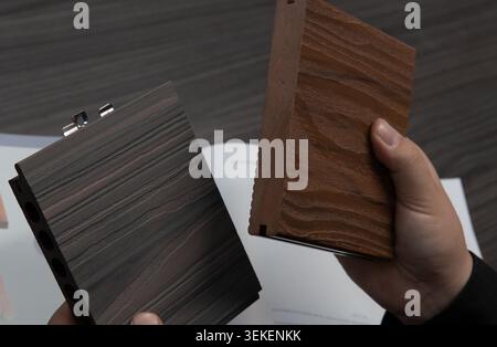shopping for flooring tiles from samples on a table Stock Photo
