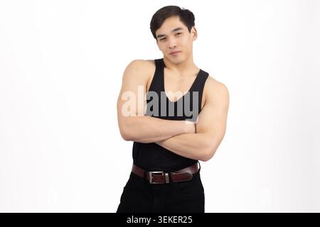 Confident athletic man standing with arms crossed chest looking forward Stock Photo