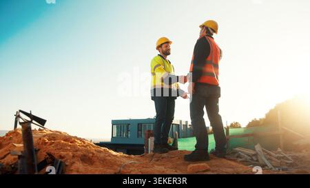 Meeting, construction and men with handshake outdoor for agreement, compliance and site evaluation. Supervisor, engineering and people shaking hands Stock Photo