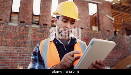 Civil engineer, scroll and man with tablet at construction site, online or project update on website. Outdoor, architect and person with tech for Stock Photo