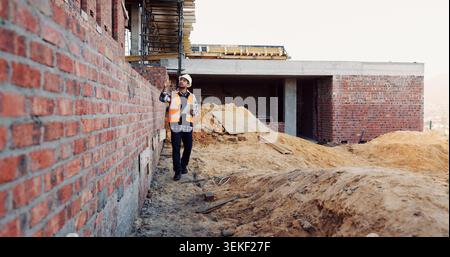 Civil engineer, inspection and man with tablet at construction site, scroll or project update on web. Outdoor, architect and person with tech for Stock Photo